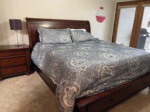 King master bedroom with door to deck
