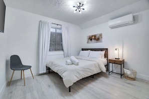 Our spacious bedroom offers ample room to relax and recharge.