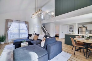 Living Room: Bright and airy space perfect for relaxing and enjoying family time together!