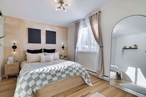 Bedroom Retreat: Bright and airy space with a queen bed, stylish decor and a tranquil vibe awaits your visit!
