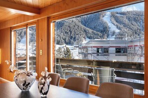 Dine with panoramic views of the Davos mountains — just minutes from hiking paths, biking trails, and summer cable cars.