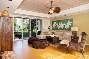 Kick back in this stylish lounge with natural textures, garden views, and plenty of sunshine.