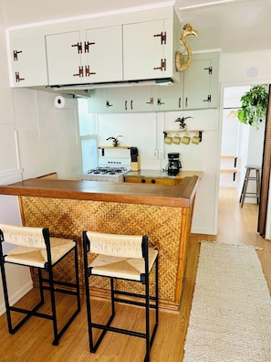 Bar dining, with a fully-equipped kitchen.