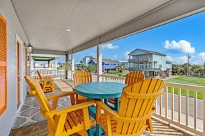 Enjoy sunny days on the deck with vibrant chairs and a perfect view!