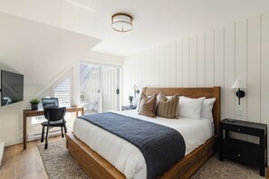 Main Bedroom - King bed, desk, ensuite bathroom, closet for storage and your very own private patio.