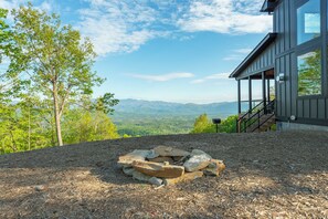 Nearly 180-degree mountain views with a park-style grill and wood burning fire pit