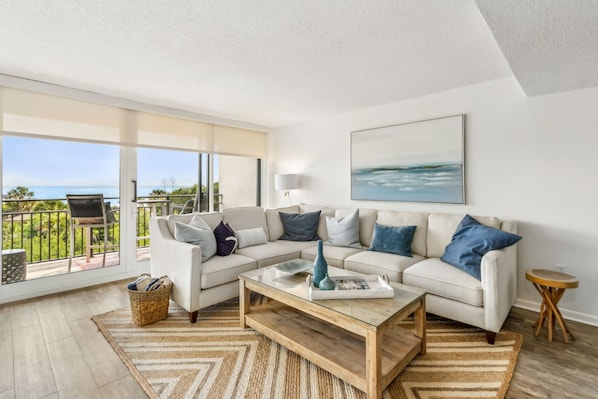 Comfortable Seating in Living Room with Direct Access to Oceanfront Balcony