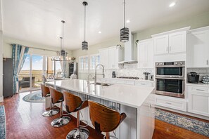 Contemporary kitchen with high-end appliances, sleek countertops, and everything ready for your next creation.