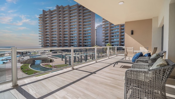 Grand balcony with the resort grounds outside.