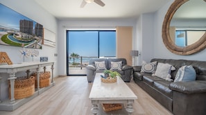 The living room and all of the unit have attractive wood panel floors