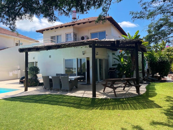Patio with seating area and view.