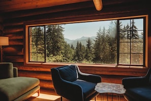 The large living room window faces south over the backyard with incredible views of several 6000 ft+ mountain peaks. Every seat in the living room has a mountain view!