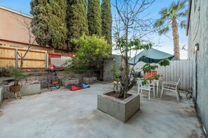 Spacious, gated backyard offering privacy and plenty of room for outdoor fun.