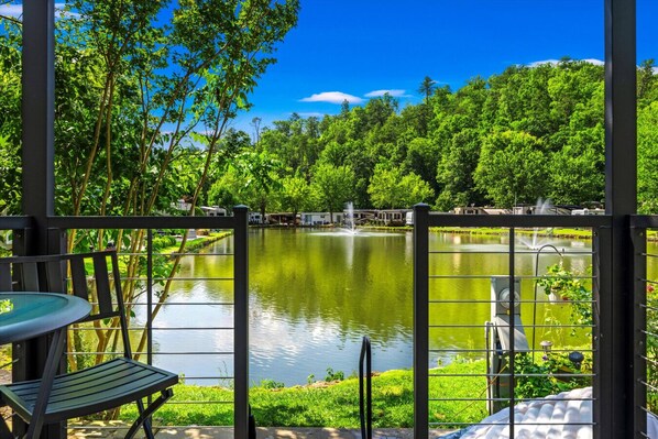 Your front row seat to the serene resort pond fully stocked with fish