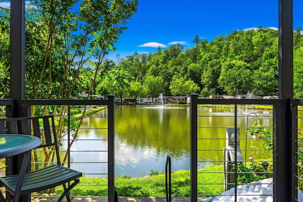 Your front row seat to the serene resort pond fully stocked with fish