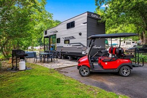 Experience this Tiny House Camper right on the water and loaded with amenities