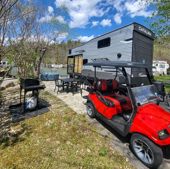 Experience this Tiny House Camper right on the water and loaded with amenities