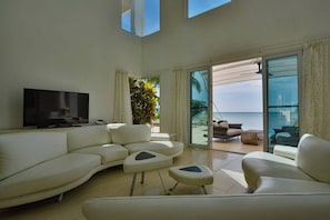 Living room opens onto the pool deck