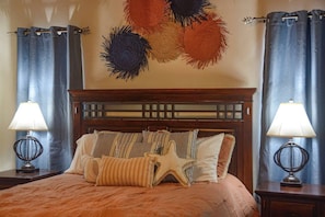 Bedroom with queen sized bed and luxurious linens