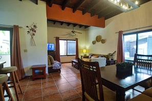 Large living space with dining table and comfortable living area