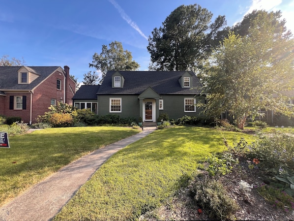 Welcoming and beautifully landscaped front yard in a peaceful neighborhood.