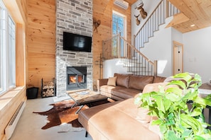 Living room with wood-burning fireplace