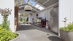 Large undercover BBQ area with Paella cooker, BBQ Rotisserie and Pizza Oven 