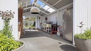 Large undercover BBQ area with Paella cooker, BBQ Rotisserie and Pizza Oven