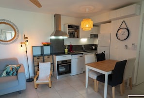 Large air-conditioned living room with fitted kitchen, lounge and living room