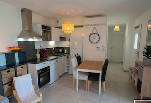 Large air-conditioned living room with fitted kitchen, lounge and living room