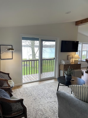 Large walkout to covered deck with amazing views of the water