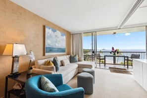 Relax in the stylish living room with comfortable seating and stunning ocean views right from the sofa.