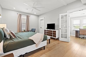 Second floor primary bedroom with king bed and sun room