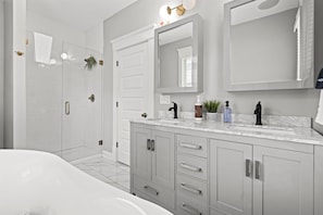 Second floor primary en suite bathroom with double sink vanity's