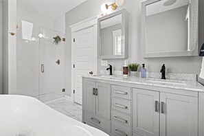 Second floor primary en suite bathroom with double sink vanity's