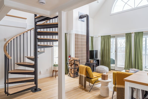 Spiral stairs leading to the loft add to the architectural charm.