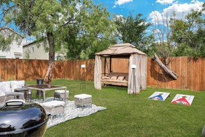 Savor the joy of cooking alfresco with our charcoal grill, creating delicious meals while enjoying quality moments with your family and friends. Plus, we include a corhole set!
