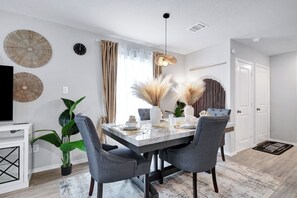 Spacious main dining table that sits 4 with full tableware and silverware included.