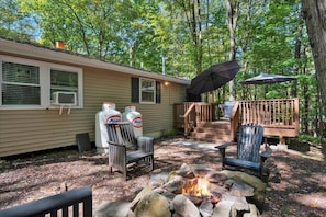 back of house with fire pit