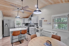 Cook side by side in a full-service kitchen designed for connection—pour the wine, share a meal, and linger a little longer.