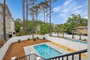 Private fenced pool with optional heating and six lounge chairs – Relax in your own backyard retreat, whether you're lounging poolside or enjoying a heated swim on cooler days.