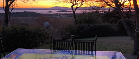 Dining table with a winter sunset on lake