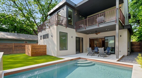 Dive into fun—this spacious pool is perfect for laps, lazy floats, or splashy good times.
