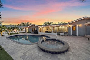 The outdoor lighting turns this backyard into a twinkling oasis in the evenings!