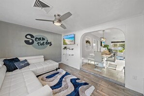 Lots of cute sitting areas around Moonlight Villa - like this beautiful sunroom with extendable sofa and Smart TV!