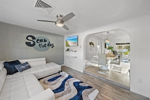 Lots of cute sitting areas around Moonlight Villa - like this beautiful sunroom with extendable sofa and Smart TV!
