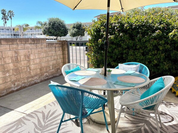 Patio attached to condo. Walk out the gate to the beach across the street. 