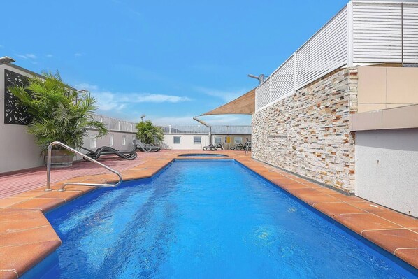 The shared pool and rooftop area is the perfect place to relax under the sun.

