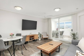 The living and dining space is open plan creating a cosy space to relax for couples or solo travellers.
