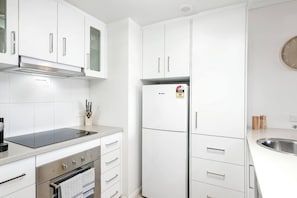 A neat kitchen makes it easy to prepare meals at home, but you’ll find plenty of shops and eateries close by.